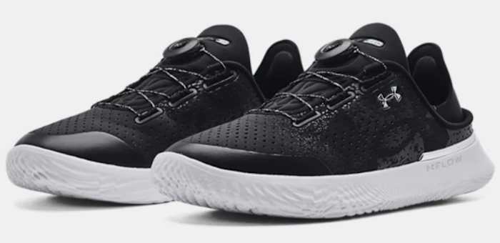 View of black and white Under Armour shoes.